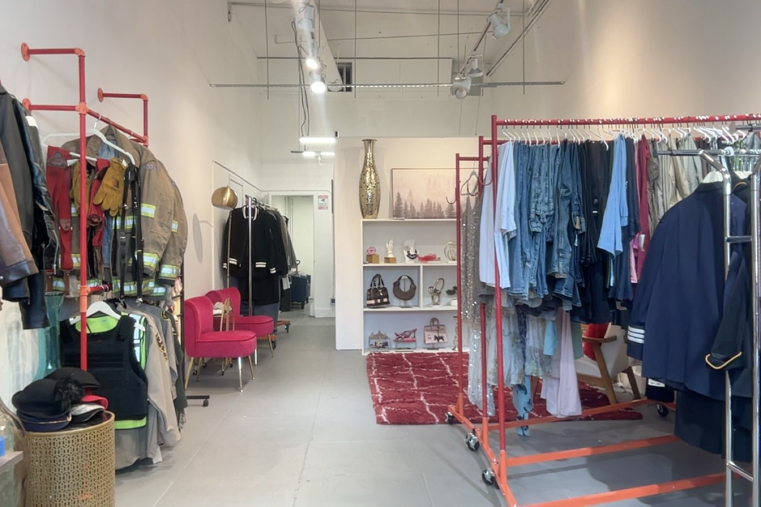 Finished studio: full racks along both walls with accessory shelving