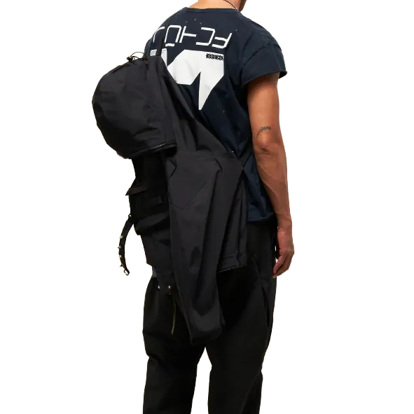 An Acronym jacket carried across the back on its own strap system