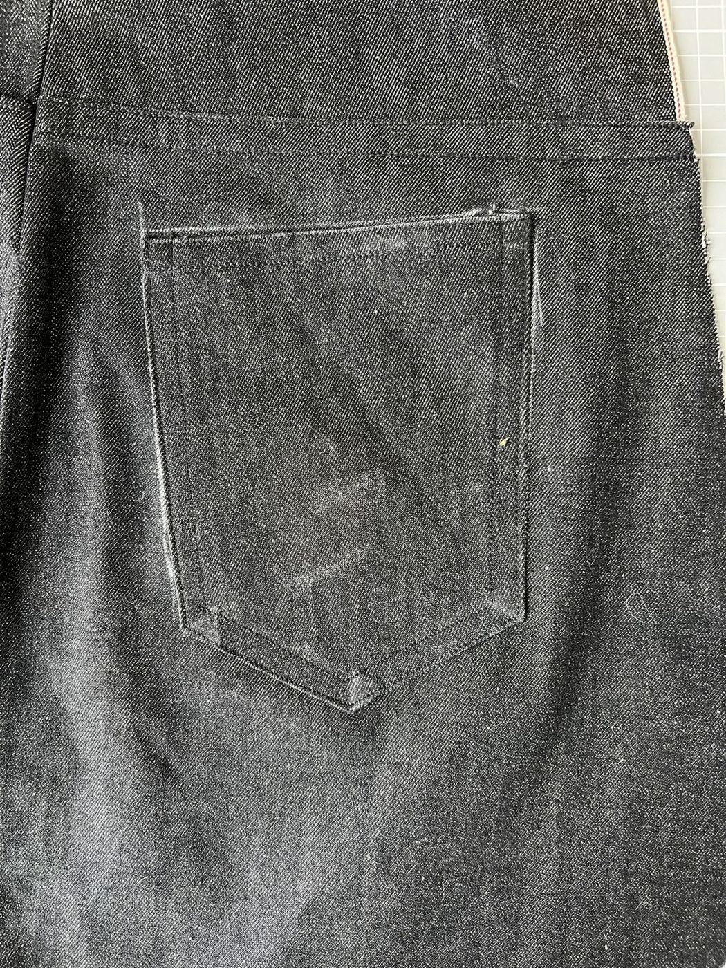 Back pocket set below the yoke